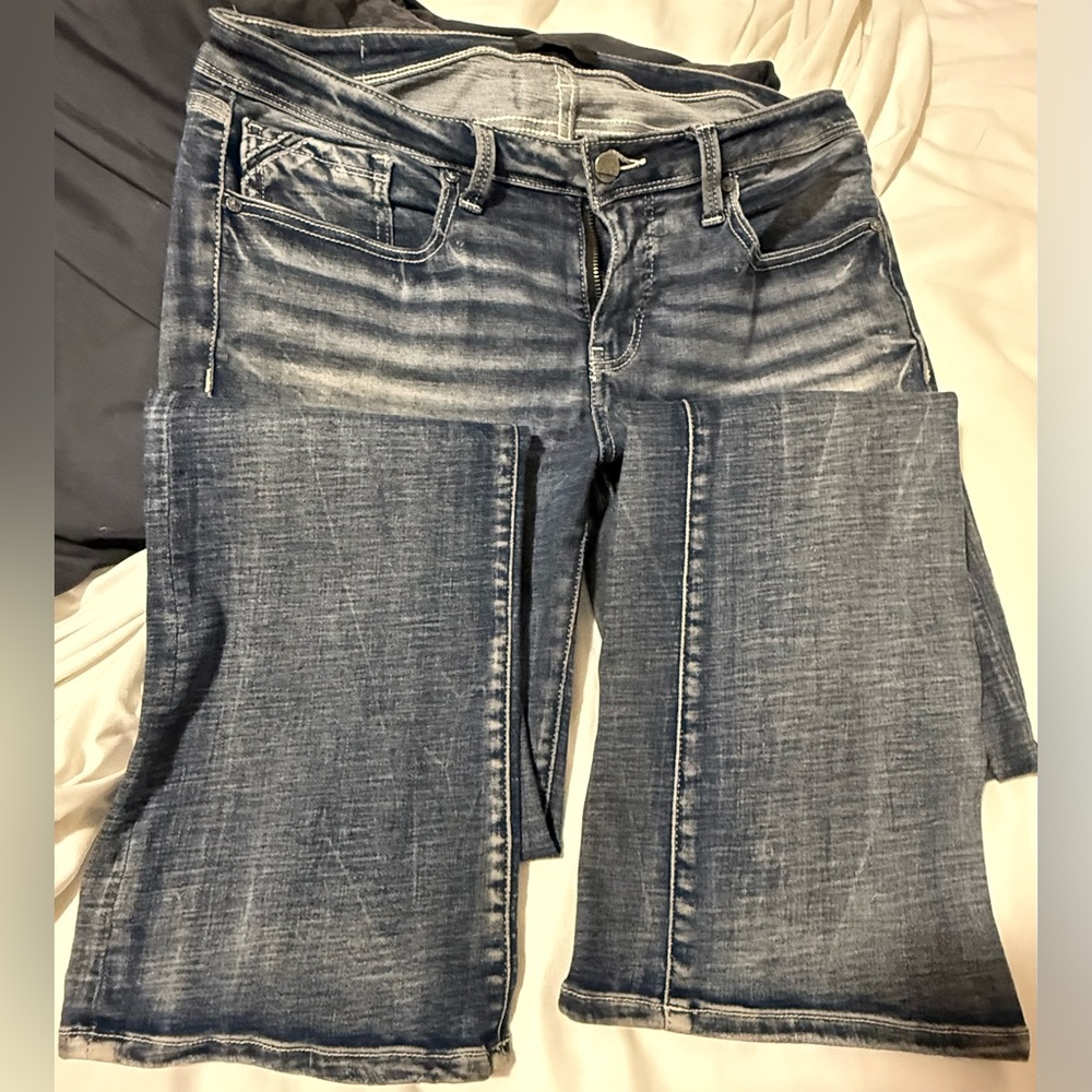 Buckle black bootcut jeans
